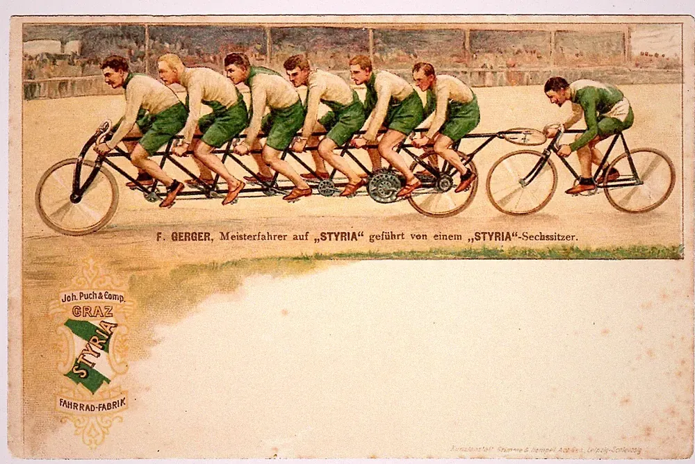 POSTCARD STYRIA BICYCLE ADVERTISING MEN ON TANDEM RACING CYCLE
